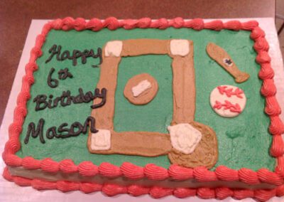 A personalized birthday cake for Mason with a cricket theme