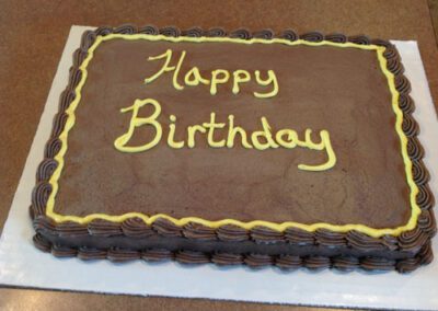 A chocolate birthday cake. The cake is made with chocolate flavoring, perfect for celebrating a special occasion with a rich and decadent dessert