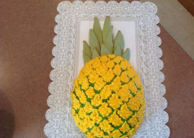 A creatively baked cake that resembles a pineapple